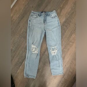 Light blue Hollister jeans with rips and the knees.